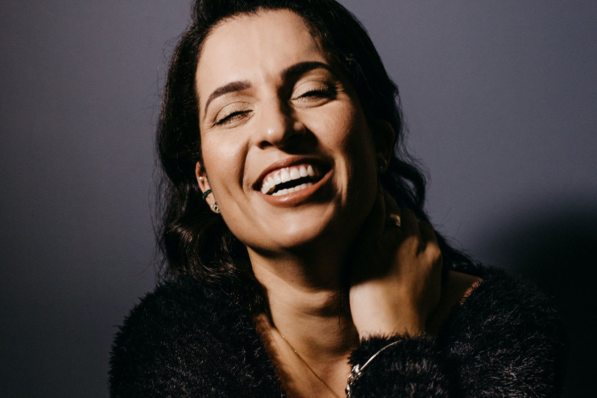 A woman smiling and laughing
