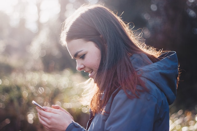 Teen looking at a phone