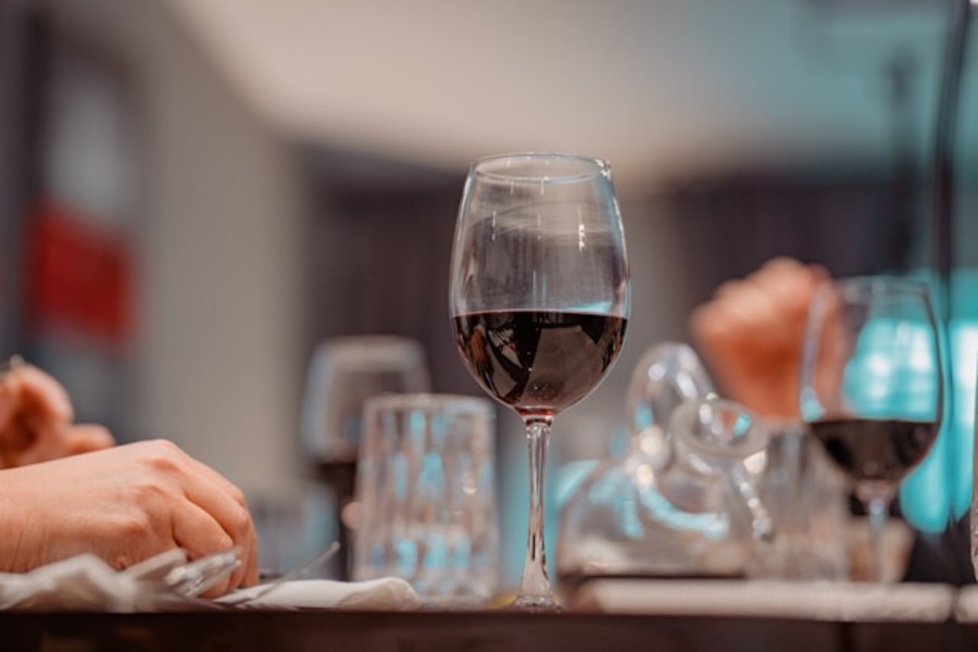 Glass of wine on a table.